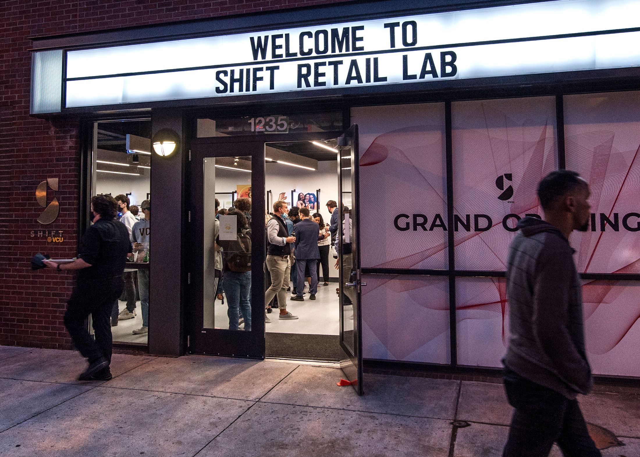 nightime view of the Shift Retail Lab storefront and marquee on the opening night