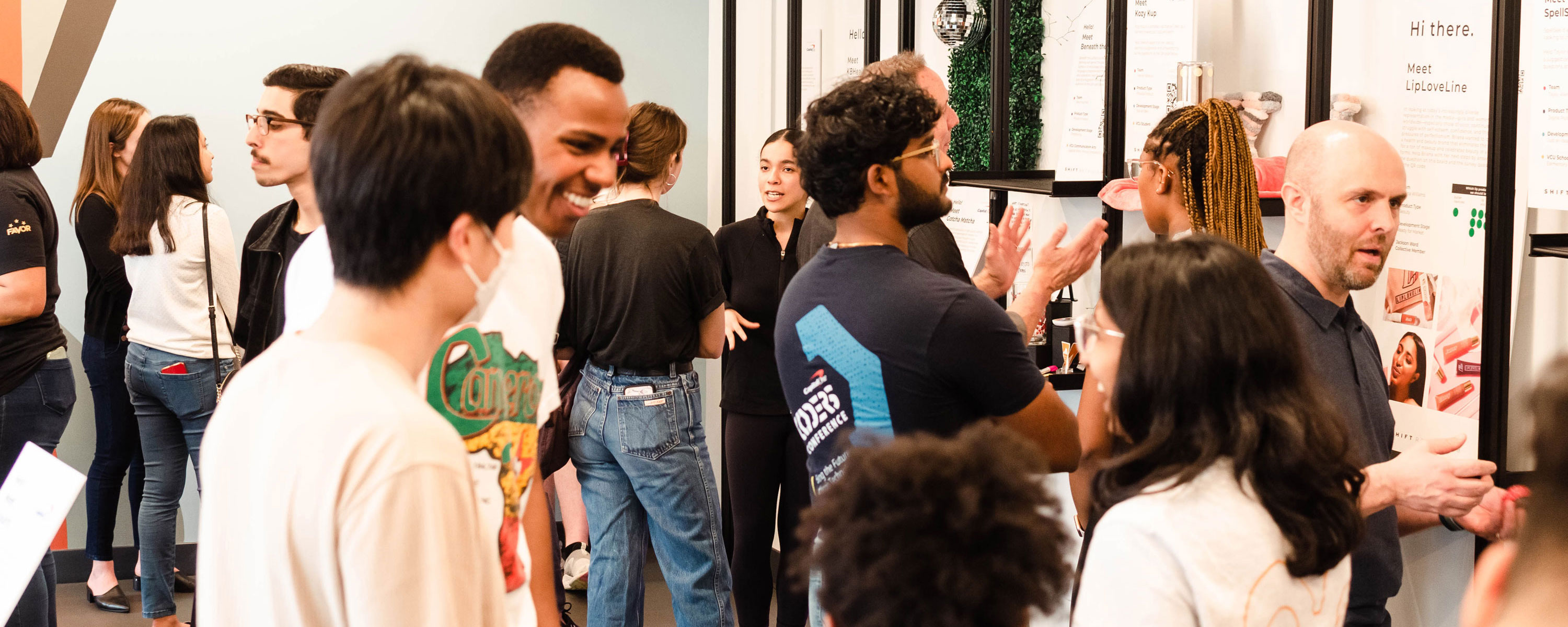 students gather and talk in the Shift Retail Lab